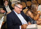 Garrett O'Rourke signs a ticket at the Fasig-Tipton Saratoga sale