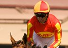 Lookin At Lucky and jockey Garrett Gomez return to winner's circle after winning the Best Pal Stakes.