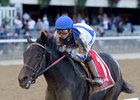 Elate is in control at the front of the field in the Beldame Stakes
