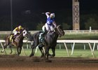 Ricardo Santana Jr. throws a fist in the air as Untrapped crosses the wire first in the Oklahoma Derby