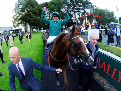 Decorated Knight and Andrea Atzeni after winning the Qipco Irish Champion Stakes for trainer Roger Charlton