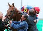 Calvin Borel and Buff Bradley embrace after The Player's Fayette Stakes victory at Keeneland