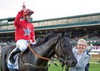 Daniel Tudhope celebrates aboard Suedois after winning the Shadwell Turf Mile at Keeneland
