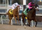 Win the War surges ahead of Grace and Dignity to win the Glorious Song Stakes in the Woodbine stretch
