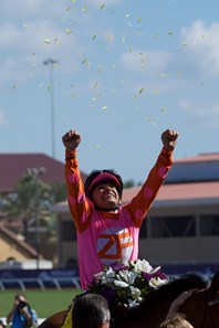 Mike Smith celebrates winning the 14 Hands Juvenile Fillies atop Caledonia Road at Del Mar on November 4, 2017.