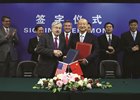 Kentucky agriculture commissioner Ryan Quarles (center) stands behind U.S. Ambassador to China Terry Branstad and Minister Zhi Shuping after signing an agreement to resume U.S. equine exports to the People’s Republic of China