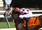 Jockey Channing Hill gives Farrell a kiss after her easy victory in the Chilukki Stakes
