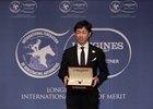 Yutaka Take accepts the Longines and IFHA International Award of Merit