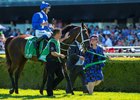 Co-owner Debbie Kepitis leads Winx and jockey Hugh Bowman after the 6-year-old mare's third Chipping Norton Stakes win at Randwick Racecourse