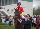 Rodolphe Brisset leads Quip after the colt's win in the Tampa Bay Derby at Tampa Bay Downs
