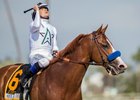 Justify and jockey Mike Smith after their Santa Anita Derby win