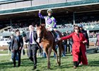 Good Magic heads to the winner's circle after taking the Blue Grass Stakes