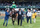 Peter Brant (right) leads Sistercharlie to the winner's circle after her Jenny Wiley Stakes score at Keeneland