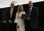 From left, Peter Sacopulos, secretary of ITOBA, Rachel McLaughlin, on-air racing analyst and host of the ITOBA banquet, and Jon Schuster, vice president and general manager of racing.