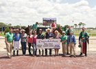 Friends and family join jockey Mike Allen in Tampa Bay Downs winner's circle after he secured the 2,000th victory of his career