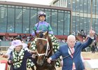 Lawana and Robert Low lead Magnum Moon and Luis Saez into the winner's circle at Oaklawn Park