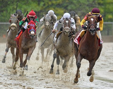 (May 18, 2018) Irish War Cry, maroon cap, Jose Ortiz up, on his way to winning the 48th running of the Gr/3 Pimlico Special