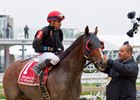 Robbie Medina greets Fire Away and Manuel Franco after their Dixie Stakes win at Pimlico Race Course