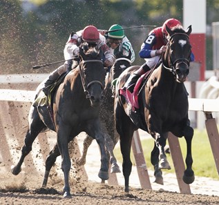 June 8, 2002. ALEXANDER BARKOFF
Victor Espinoza whips War Emblem to no avail as Belmont winner Sarava, left and Medaglia d'Oro battle it out down the stretch. War Emblem was soundly defeated spoiling his bid for the Triple Crown.