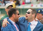Sol Kumin (left) and trainer Brad Cox celebrate Monomoy Girl's Kentucky Oaks