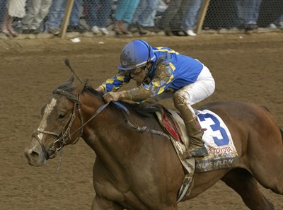 Harlan's Holiday with Edgar Prado up wins the Blue Grass Stakes (gr. I) at Keeneland on April 13, 2002.