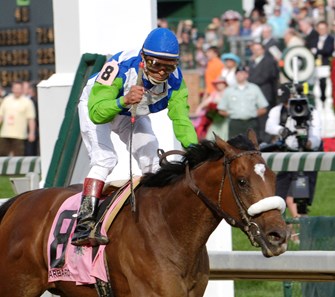 PHOTO BY SKIP DICKSTEIN - Jockey Edgar Prado pumps his fist after winning the 132nd Running of the Kentucky Derby on Barbaro at Churchill Downs in Louisville, Kentucky May 6, 2006.