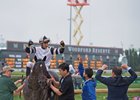 Trainer Ben Colebrook (right) and jockey Jose Ortiz pump their fists after Limousine Liberal wins the Churchill Downs Stakes