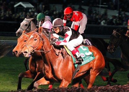 Sagamore Farm's longshot Shared Account, ridden by Edgar Prado, held off heavily favored defending champion Midday in the Breeders' Cup Filly & Mare Turf.
