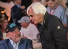 Jack Wolf (left) talks things over with trainer Bob Baffert at the Preakness Stakes draw at Pimlico Race Course