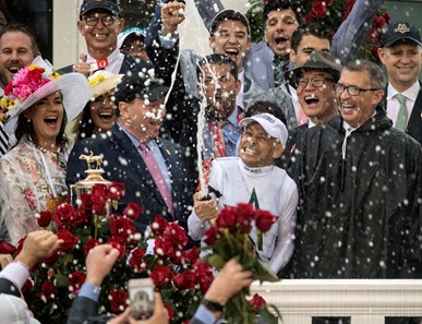 Jockey Mike Smith sprays the champagne after he wins the 144th running of the Kentucky Derby with Justify May 5, 2018 at Churchill Downs in Louisville, Kentucky