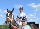 Carlos H. Marquez Jr. returns after his 3,000th win in a claiming race at Arlington International Racecourse