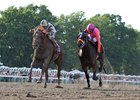 Supreme Aura (outside) battles through the stretch with Roaming Union to win the Pegasus by a neck at Monmouth Park