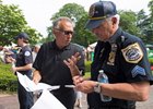NBC's Billy Rapaport going over plans with security ahead of the Belmont Stakes