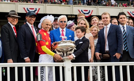 Connections and trainer surround jockey Mike Smith after winning the 150th running of the Belmont Stakes