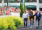 Jimmy Barnes (left) and Bob Baffert walk with Justify in the paddock at Churchill Downs