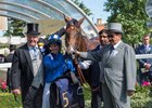 Sir Michael Stoute (left) with jockey Jim Crowley and Sheikh Hamdan Al Maktoum (far right) in the winner's enclosure with Eqtidaar