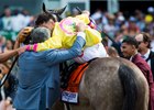 Co-owner Michael Dubb embraces Irad Ortiz Jr. after A Raving Beauty's Just a Game score