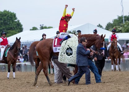 Justify and Mike Smith celebrate after winning the Belmont Stakes at Belmont Park on June 9, 2018.