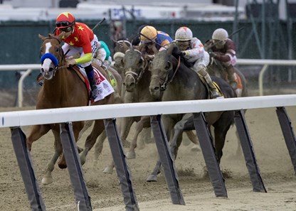 Justify and Mike Smith turn for home leading the field in the Belmont Stakes at Belmont Park on June 9, 2018.
