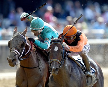 (June 8, 2018) Imperial Hint, orange cap, holds off Whitmore, to win the Gr.2 True North at Belmont...