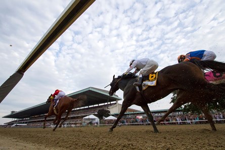 Justify and Mike Smith head down the stretch in the Belmont Stakes at Belmont Park on June 9, 2018.
