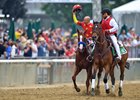 Mike Smith salutes the Belmont Stakes Day crowd aboard Justify