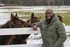 New York Thoroughbred Breeders director Najja Thompson plays with yearlings at Song Hill Farm Monday Jan 18, 2021 in Mechanicville, N.Y. Photo by Skip Dickstein