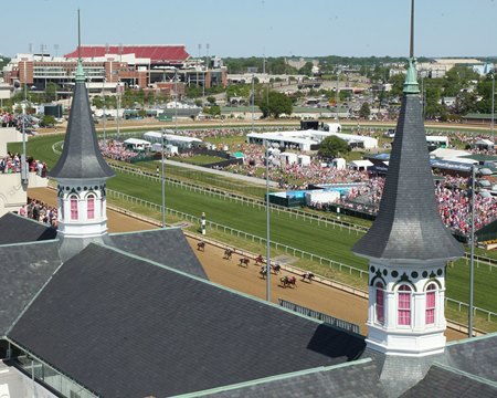 Horses race through the stretch in the 2023 La Troienne Stakes beneath the Twin Spires of Churchill Downs