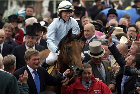 North Light is led to the winner's enclosure after his triumph in the 2004 Epsom Derby at Epsom Racecourse