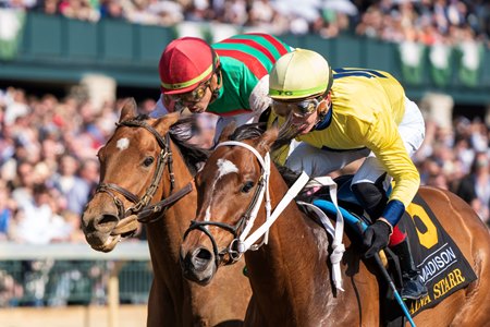 Alva Starr (yellow silks) holds off Vahva in the Madison Stakes at Keeneland