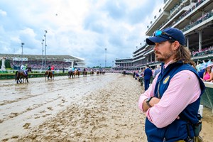 Kentucky Horse Racing Commission chief veterinarian Dr. Nick Smith watches horses in the post parade May 3 at Churchill Downs