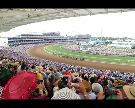 Part of a Derby day crowd of 156,710 fans watch the Kentucky Derby at Churchill Downs