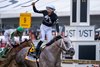 Jaime Torres celebrates winning the Preakness Stakes aboard Seize the Grey