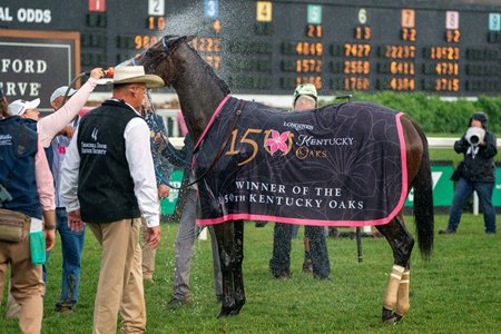 Thorpedo Anna gets sprayed down in front of the toteboard after the Kentucky Oaks
